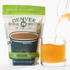 A front facing pouch of Denver Bone Broth's healthy Vital Veggie flavor. Next to the pouch, there is a small glass mug with the healthy, natural bone broth being poured into it.